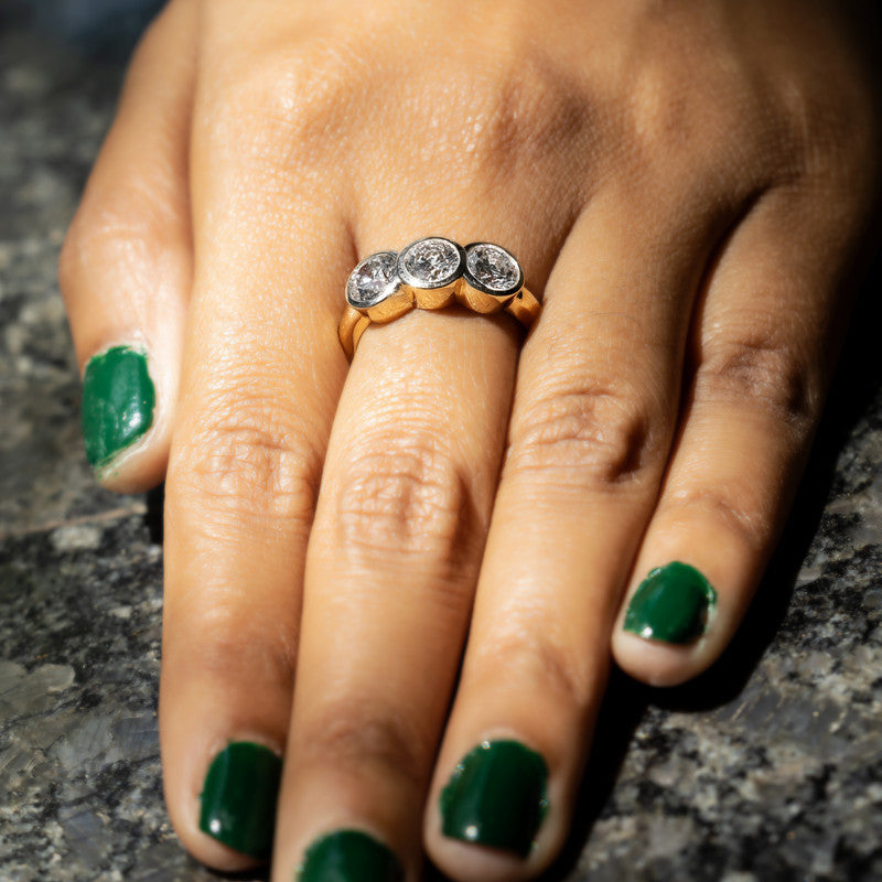 Three-Stone Round Brilliant Diamond Bezel-Set Ring