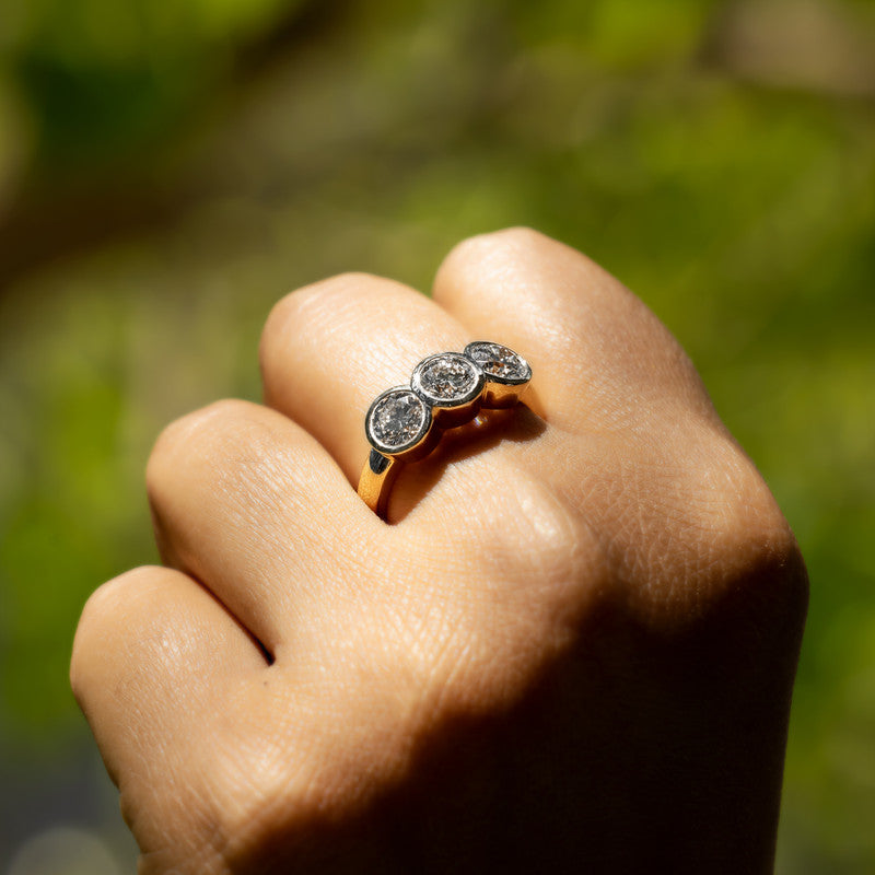 Three-Stone Round Brilliant Diamond Bezel-Set Ring