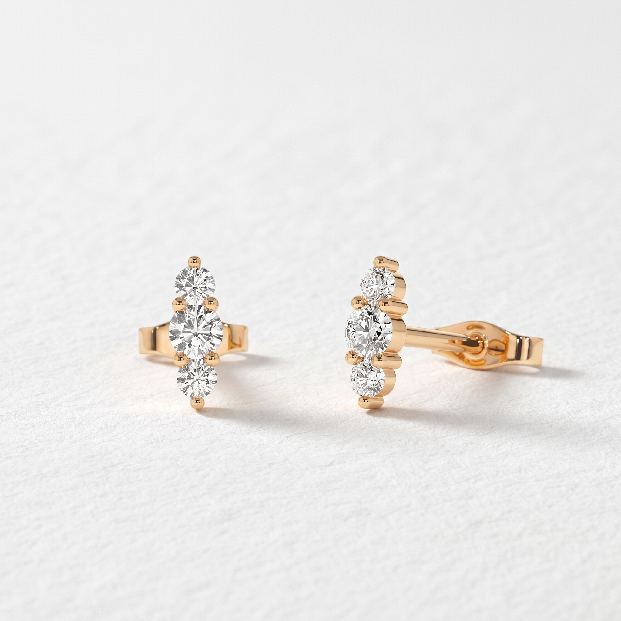 Graduated Three Stone Diamond Stud Earrings