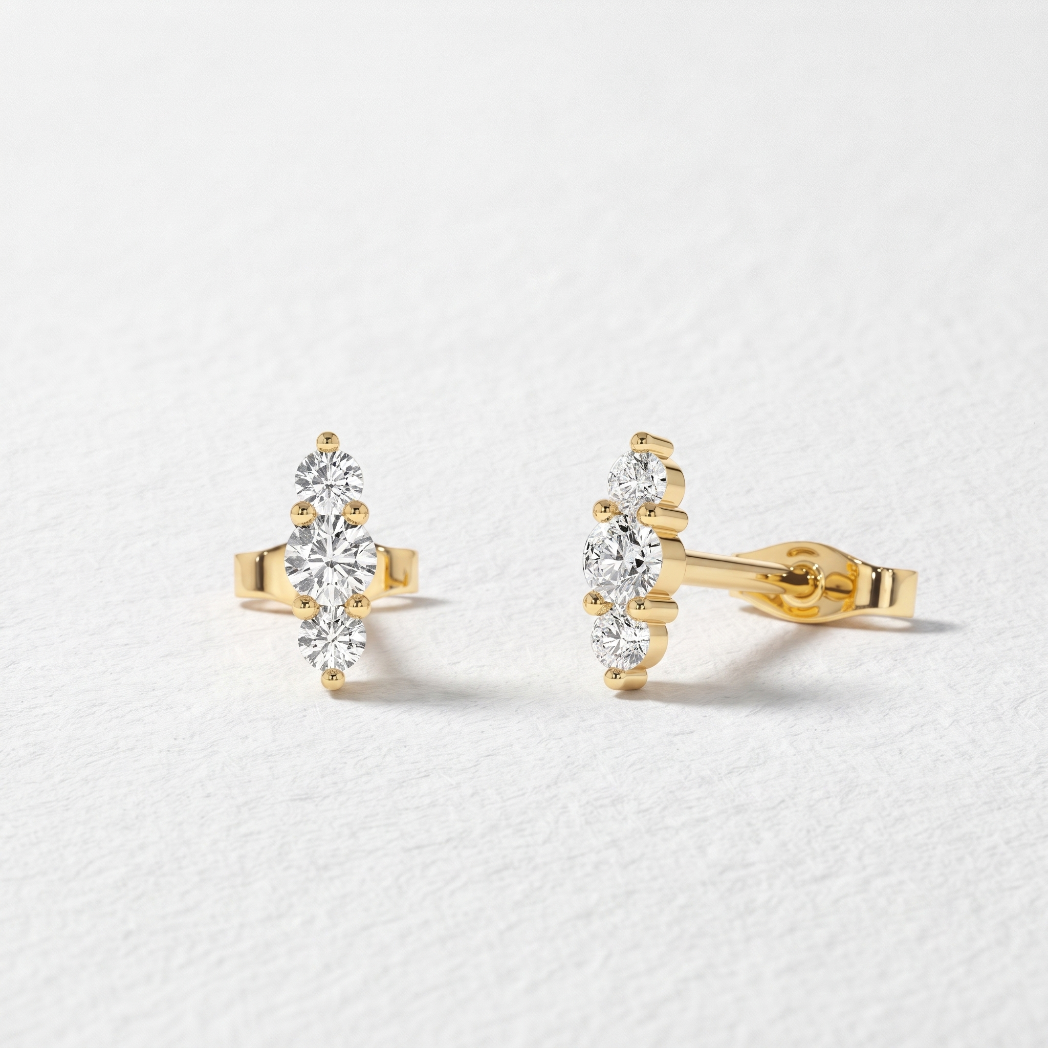 Graduated Three Stone Diamond Stud Earrings